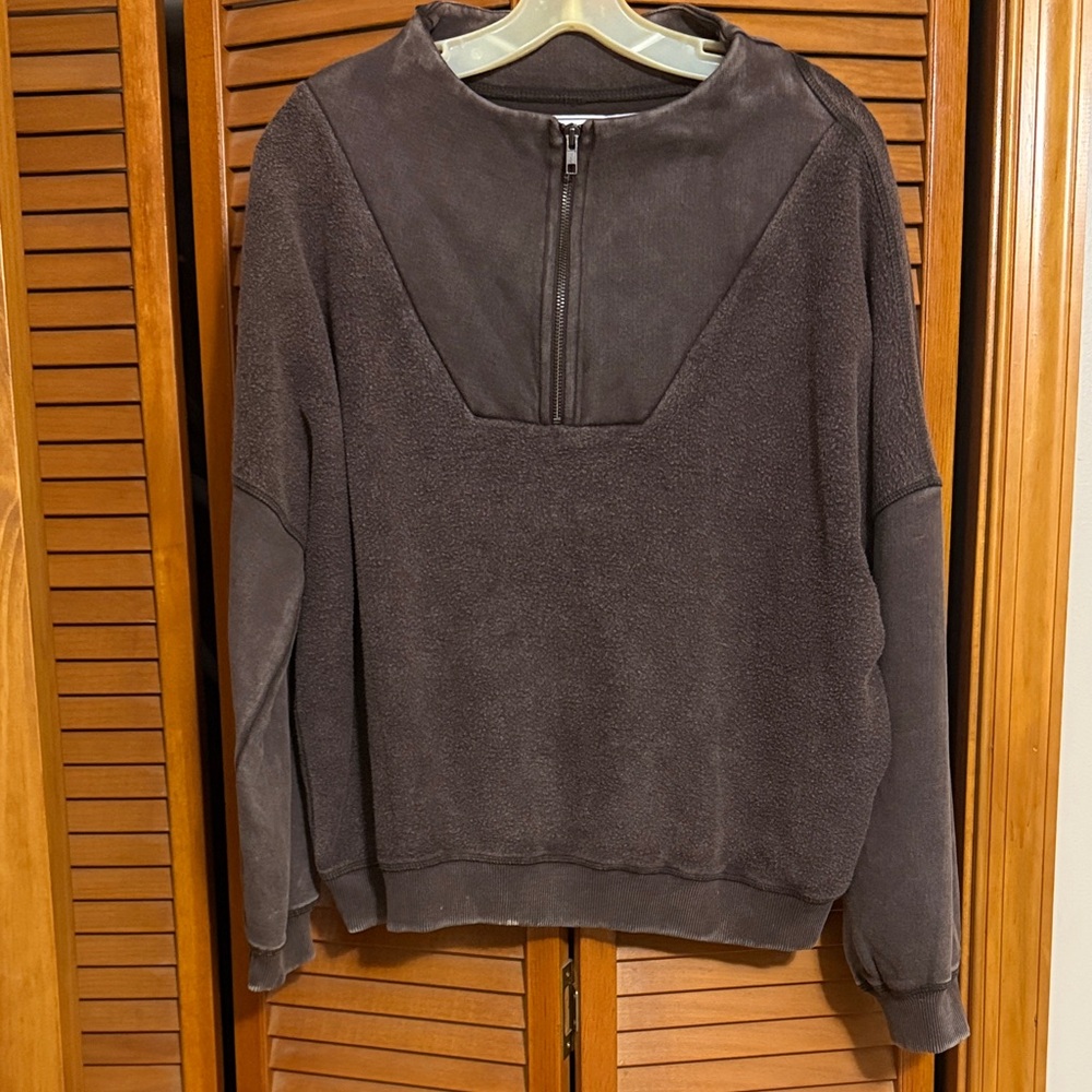 Chelsea DeBoer quarter zip sweatshirt with terry cloth.